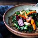 <p>This earthy bowl of lentils bursting with Middle Eastern flavors is topped with leftover roasted root veggies from a large batch for an easy weeknight dinner. Keep it vegan or add a drizzle of plain yogurt for extra richness.</p>