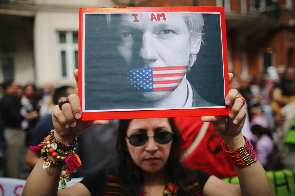 LONDON, ENGLAND - AUGUST 16: Protesters gather outside the Ecuadorian Embassy, where Julian Assange, founder of Wikileaks is staying on August 16, 2012 in London, England. Mr Assange has been living inside Ecuador's London embassy since June 19, 2012 after requesting political asylum whilst facing extradition to Sweden to face allegations of sexual assault. (Photo by Dan Kitwood/Getty Images)