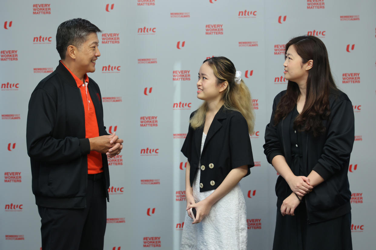 NTUC Secretary-General Ng Chee Meng interacting with young job seeker Pu Huan Jun (centre) during the launch of the Career Starter Lab initiative.