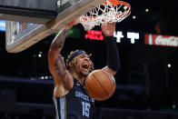 Memphis Grizzlies forward Brandon Clarke (15) dunks next against the Los Angeles Lakers during the first half of an NBA basketball game in Los Angeles, Sunday, Oct. 24, 2021. (AP Photo/Ringo H.W. Chiu)