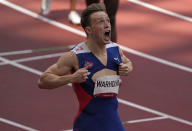 Karsten Warholm, of Norway celebrates as he wins the gold medal in the final of the men's 400-meter hurdles at the 2020 Summer Olympics, Tuesday, Aug. 3, 2021, in Tokyo, Japan. (AP Photo/Charlie Riedel)