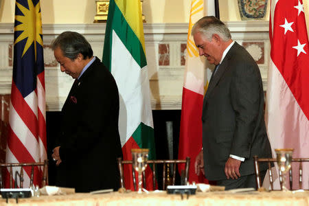 U.S. Secretary of State Rex Tillerson (R) and Malaysia's Foreign Minister Datuk Seri Anifah Aman arrive at a working lunch for the ministers of ASEAN member states at the State Department in Washington, U.S., May 4, 2017. REUTERS/Yuri Gripas