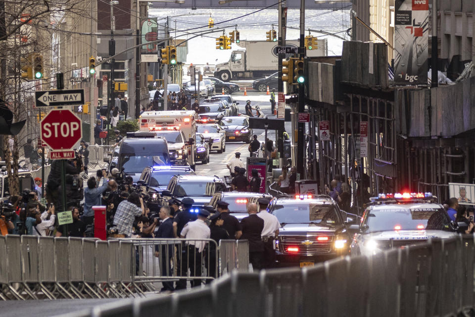 The motorcade of former President Donald Trump arrives at an Attorney General's office building for depositions in a civil investigation in New York, Thursday, April. 13, 2023. Trump is scheduled to meet with lawyers for Attorney General Letitia James, who sued Trump last year. Her lawsuit claims Trump and his family misled banks and business associates by giving them false information about his net worth and the value of assets such as hotels and golf courses. (AP Photo/Yuki Iwamura)