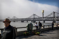 <p>Chinese men walk on the boardwalk near the “Friendship Bridge” in the border city of Dandong, Liaoning province, northern China across from the city of Sinuiju, North Korea on May 24, 2017 in Dandong, China. (Photo: Kevin Frayer/Getty Images) </p>