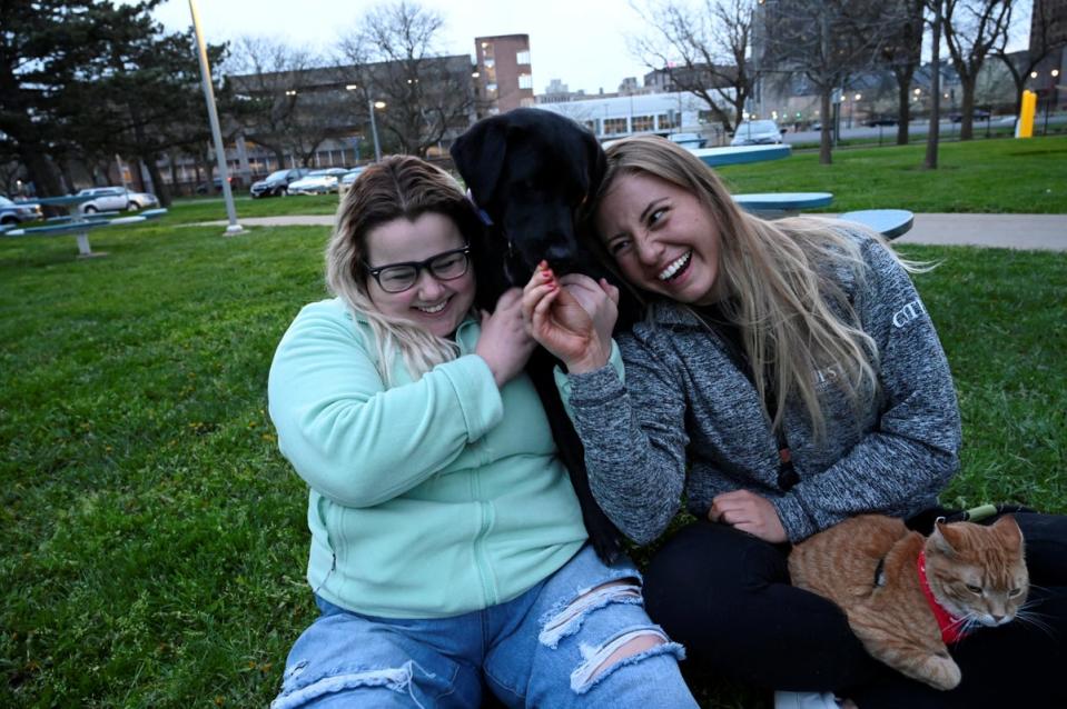 Vika Rauzina joins Nicole, and their respective pets, in their student building’s park (Reuters)