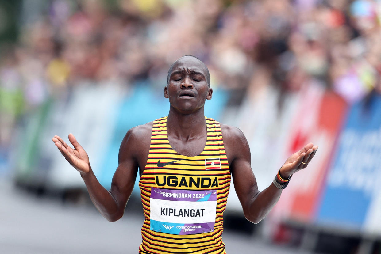 Commonwealth Games - Men's Marathon - Birmingham, Britain - July 30, 2022 Uganda's Victor Kiplangat reacts after winning the men's marathon REUTERS/Stoyan Nenov