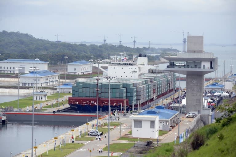 Chinese-chartered ship Cosco Shipping Panama crosses the new Agua Clara Locks during the inauguration of the expansion of the Panama Canal in Colon on June 26, 2016