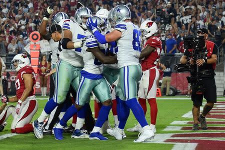 Sep 25, 2017; Glendale, AZ, USA; Dallas Cowboys wide receiver Dez Bryant (88) celebrates a touchdown against the Arizona Cardinals during the second half at University of Phoenix Stadium. Mandatory Credit: Joe Camporeale-USA TODAY Sports