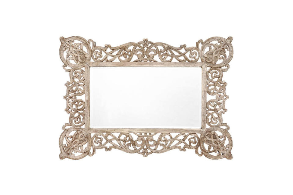 <p>This ornately carved wooden piece would be a great addition to any gallery wall.</p><p>Copperwood Mirror, $128, available at <a href="http://www.anthropologie.com/anthro/product/35417708.jsp#/" rel="nofollow noopener" target="_blank" data-ylk="slk:Anthropologie;elm:context_link;itc:0;sec:content-canvas" class="link ">Anthropologie</a>. </p>