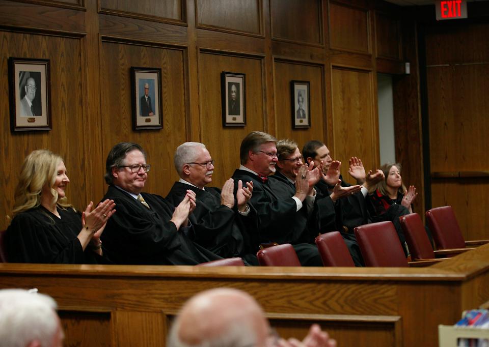 Lubbock County, district and appellate judges applaud after during the investiture ceremony of judge Tom Brummett on Tuesday after he was sworn in to begin his term as judge of Lubbock's County Court at Law #2.