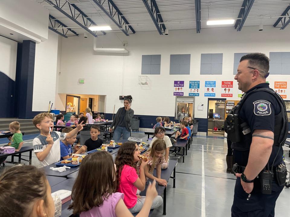 Marysville school resource officer TJ Williams interacting with Morton Elementary School students during lunchtime on May 2, 2024.