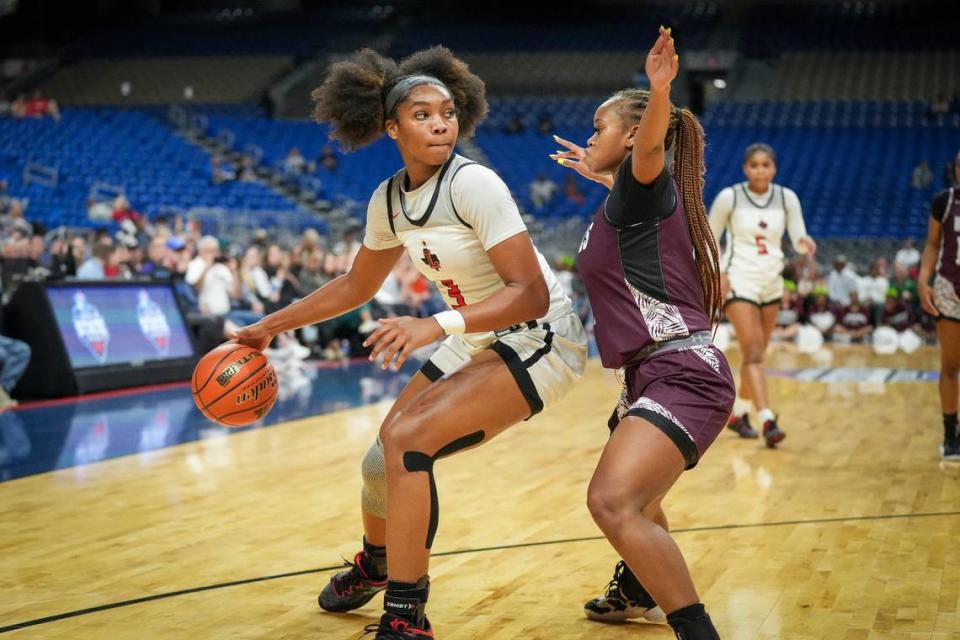 Frisco Liberty’s Jacy Abii, the Championship Game MVP, looks to score against Mansfield Timberview’s Kamryn Wilson in the Class 5A state championship game on Saturday, March 2, 2024 at the Alamodome in San Antonio, Texas. Liberty rallied to defeat Timberview 60-51.