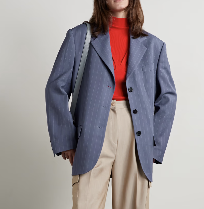 A model wears an Acne Studios blazer.