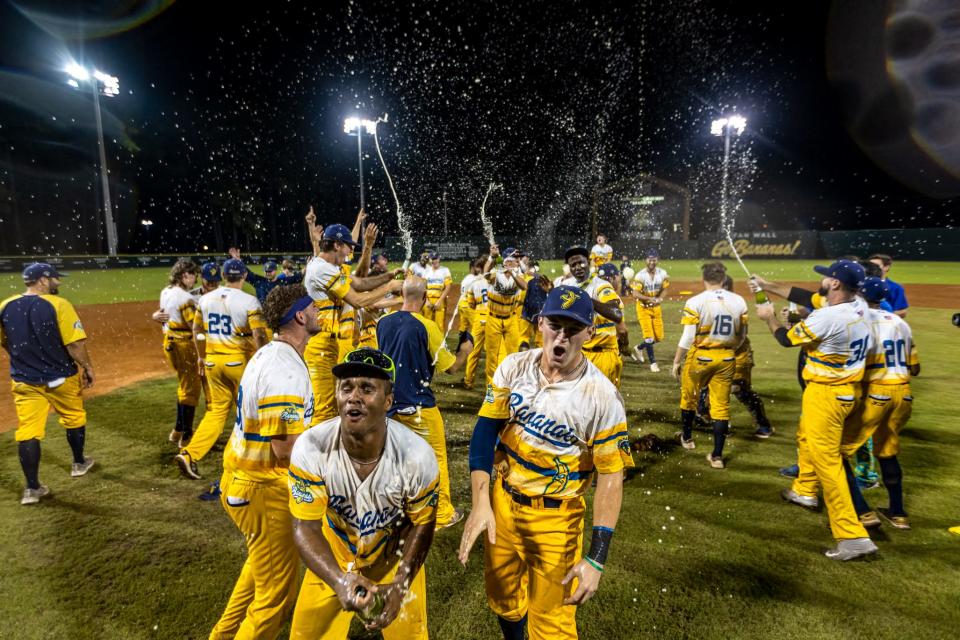 Banana players celebrate after beating Morehead City to win the 2021 Coastal Plain League championship.