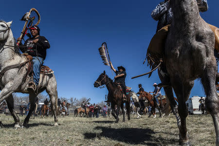 The Fort Laramie treaty riders get started in the morning in Jay Em, Wyoming, U.S., April 27, 2018. REUTERS/Stephanie Keith