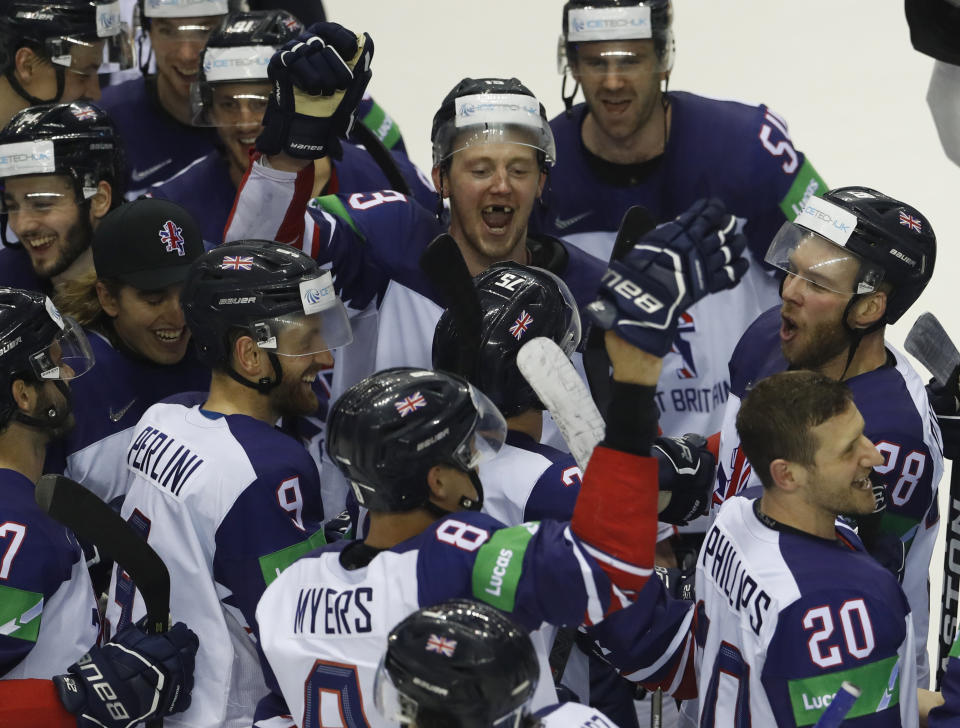 Players of Great Britain celebrate after winning the Ice Hockey World Championships group A match between France and Great Britain at the Steel Arena in Kosice, Slovakia, Monday, May 20, 2019. (AP Photo/Petr David Josek)