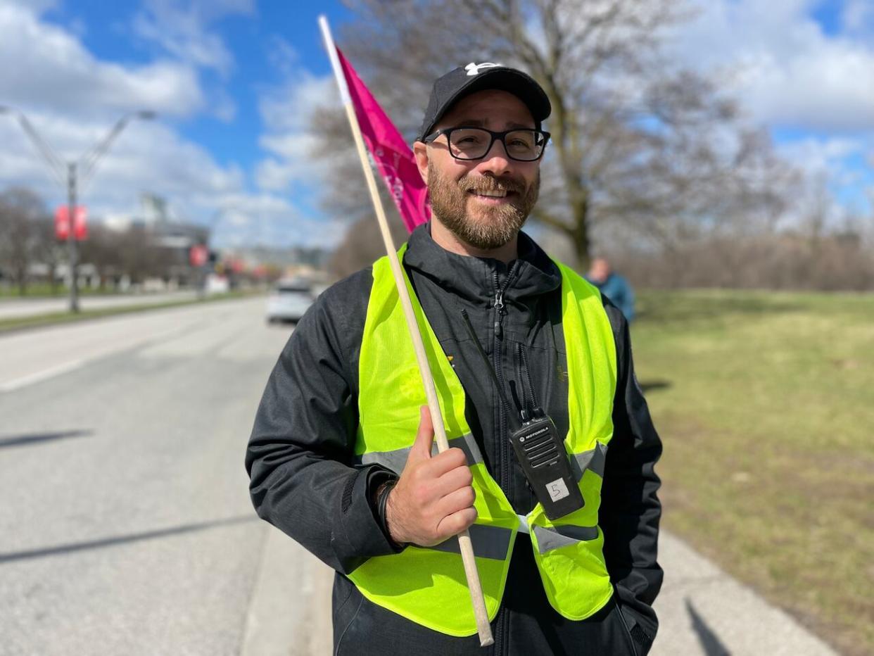 A member of CUPE 3903 on strike at York University on Monday. The union and the university have reached a tentative agreement that could bring an end to a strike that's in its eighth week. (Chris Glover/CBC - image credit)