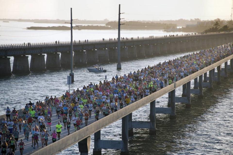 In this aerial photo provided by the Florida Keys News Bureau, the Seven Mile Bridge, near Marathon, Fla., in the Florida Keys is packed with contestants to compete in the Seven Mile Bridge Run Saturday, April 5, 2014. The annual event attracted 1,500 runners who ran over the longest of 42 bridges over water that help comprise the Florida Keys Overseas Highway.