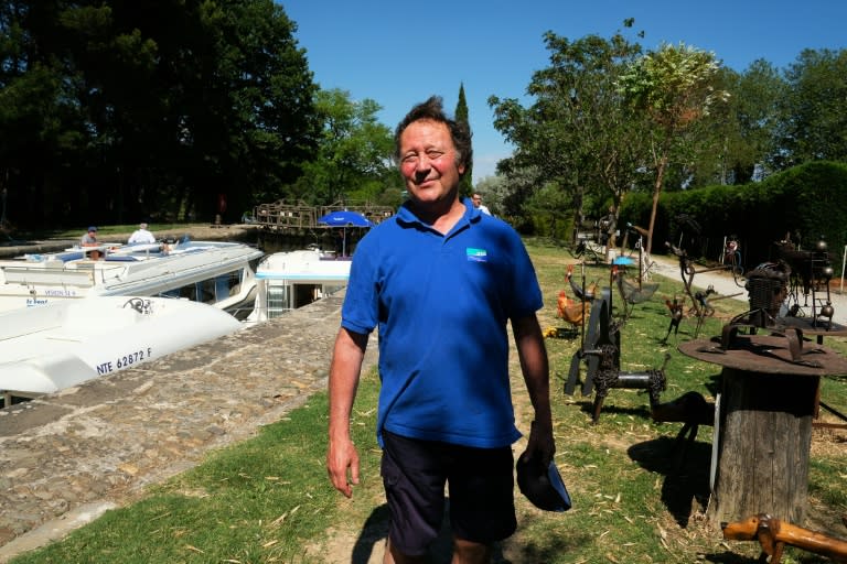 Joel Barthes, lock-keeper and sculptor, poses for a photo in Puicheric on the Canal du Midi, near Carcassonne, southern France