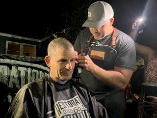 Ogunquit Selectman Rick Dolliver gets some finishing touches following his first haircut in more than two years on Wednesday, Sept. 28, 2022. Dolliver shaved his head as part of his efforts to raise $100,000 for the Maine Children's Cancer Program.