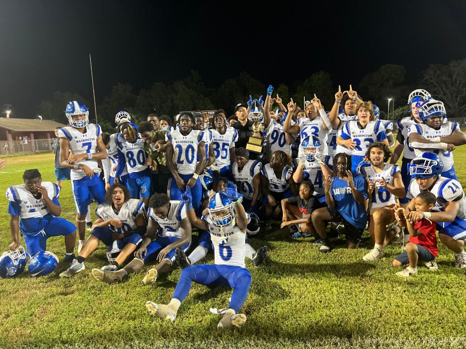 The Booker T. Washington football team celebrates after defeating Pensacola High 39-0 in the third-annual Mayor's Bowl on Friday, Aug. 26, 2023 from Jim Scoggins Stadium.