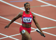 LONDON, ENGLAND - AUGUST 10: Carmelita Jeter of the United States celebrates winning gold in the Women's 4 x 100m Relay Final on Day 14 of the London 2012 Olympic Games at Olympic Stadium on August 10, 2012 in London, England. (Photo by Stu Forster/Getty Images)