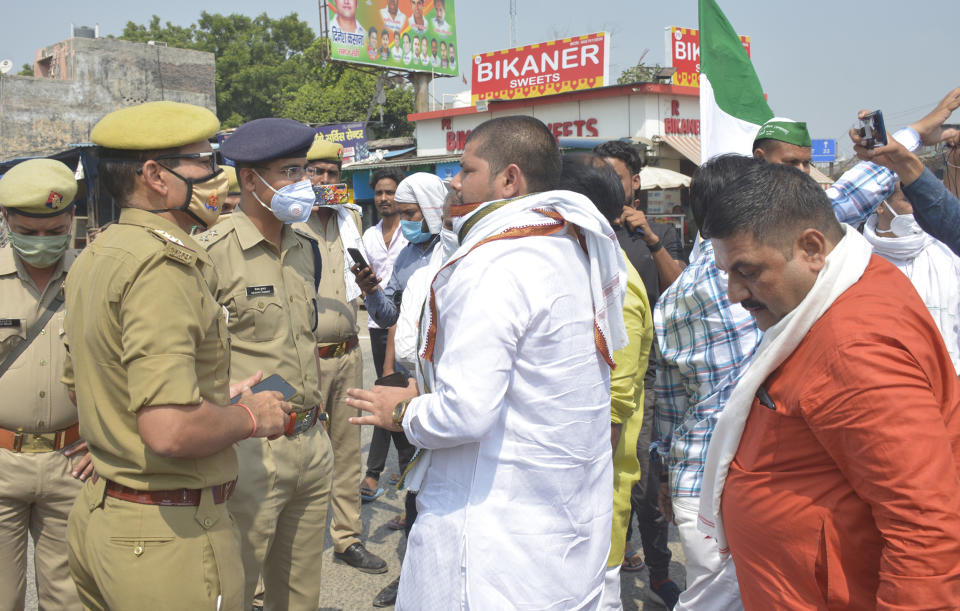 Members of the Bharatiya Kisan Union (BKU) blocking the Delhi- Ghaziabad border at Bhopura crossing in protest against farms bills, on September 25, 2020 in Ghaziabad, India. The two bills - the Farmers (Empowerment and Protection) Agreement on Price Assurance and Farm Services Bill, 2020 and the Farming Produce Trade and Commerce (Promotion and Facilitation) Bill, 2020 - were passed by the Rajya Sabha despite uproar and strong protest by the Opposition parties in the house. (Photo by Sakib Ali/Hindustan Times via Getty Images)