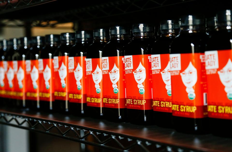 Date syrup from Date Lady after being bottled and prepared for shipment at the Date Lady warehouse on East Commercial Street on Wednesday, May 31, 2023