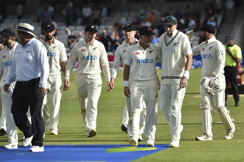 New Zealand players leave the field at the end of play on the second day of the third cricket test match between England and New Zealand at Headingley in Leeds, England, Friday, June 24, 2022. (AP Photo/Rui Vieira)