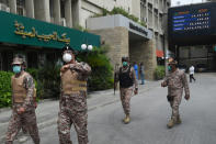 Paramilitary officers inspect the premisses of the Pakistan Stock Exchange building following an attack by gunmen in Karachi on June 29, 2020. - At least six people were killed when gunmen attacked the Pakistan Stock Exchange in Karachi on June 29, with a policeman among the dead after the assailants opened fire and hurled a grenade at the trading floor, police said. (Photo by Rizwan TABASSUM / AFP) (Photo by RIZWAN TABASSUM/AFP via Getty Images)