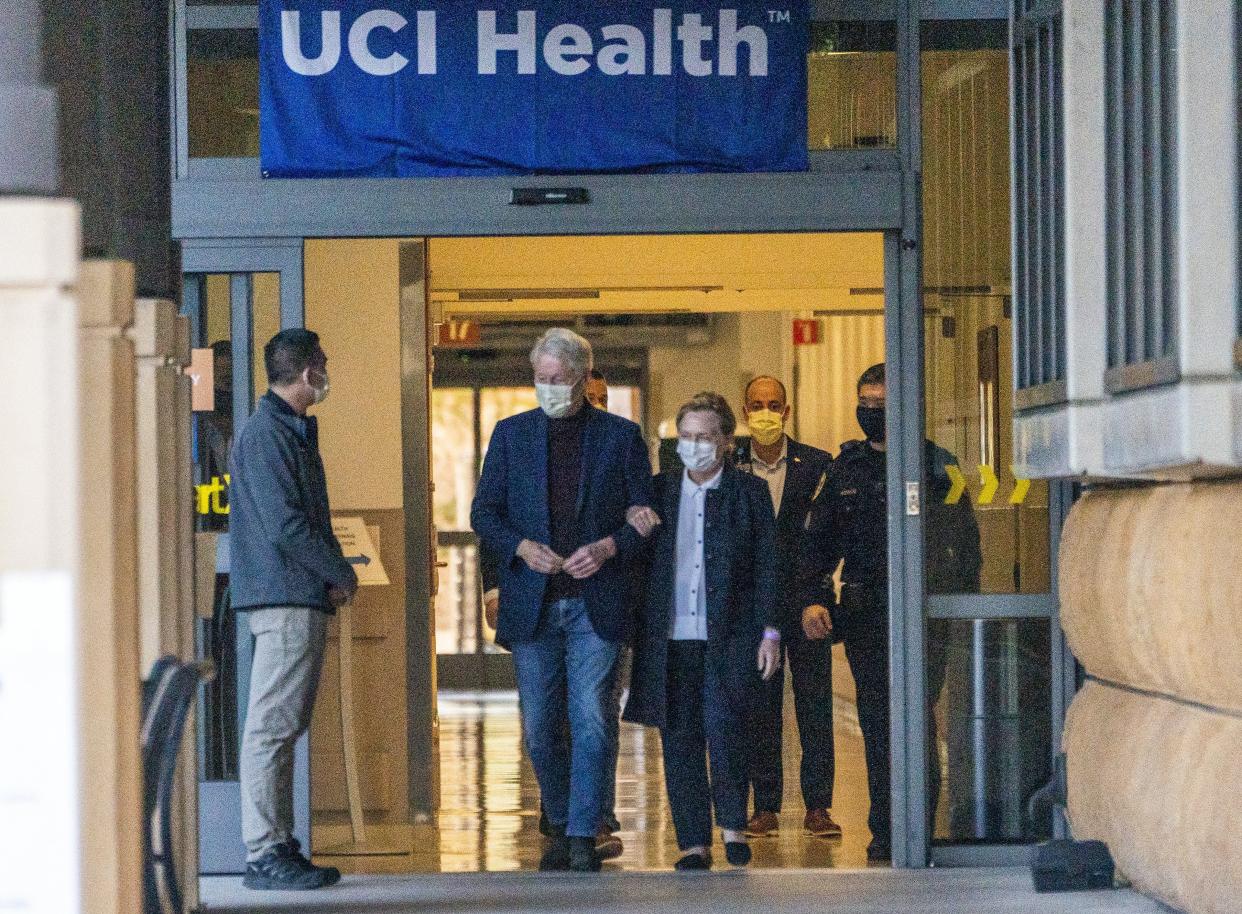 Former President Bill Clinton and former U.S. Secretary of State Hillary Clinton leave the University of California Irvine Medical Center in Orange, Calif. last month after he was hospitalized for six days for treatment of a urological infection and sepsis.