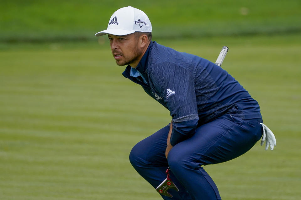 Xander Schauffele, of the United States, checks the break on the 17th green during the second round of the US Open Golf Championship, Friday, Sept. 18, 2020, in Mamaroneck, N.Y. (AP Photo/Charles Krupa)