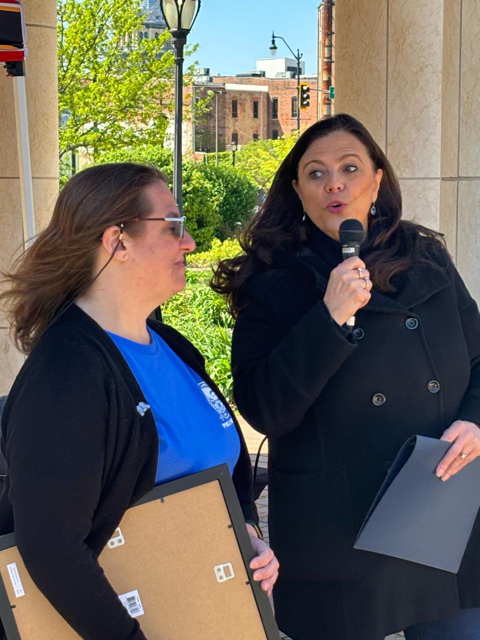 Springfield Mayor Misty Buscher, right, recognizes Kristina LoRusso, community program coordinator in the Office of Public Works, at the 32nd Annual Earth Awareness Fair at Union Square Park on April 20, 2024.