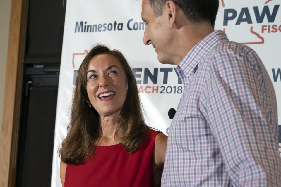 Tim Pawlenty stands with his wife, Mary, as he concedes his run for governor at his election night gathering at Granite City Food and Brewery, Tuesday, Aug. 14, 2018, in Eagan, Minn. (Glen Stubbe/Star Tribune via AP)