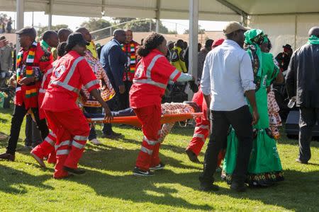 Medics attend to people injured in an explosion during a rally by Zimbabwean President Emmerson Mnangagwa in Bulawayo, Zimbabwe June 23, 2018. Tafadzwa Ufumeli/via REUTERS