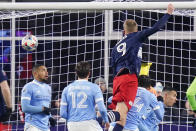 New England Revolution forward Adam Buksa (9) scores against New York City during the first half of an MLS playoff soccer match, Tuesday, Nov. 30, 2021, in Foxborough, Mass. (AP Photo/Charles Krupa)