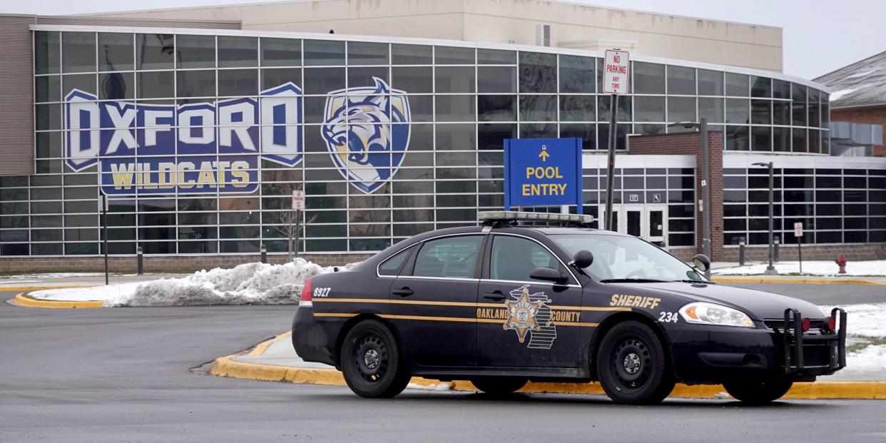 A police vehicle remains parked outside of Oxford High School on December 01, 2021 in Oxford, Michigan.