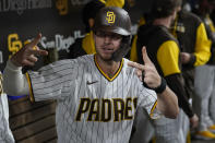 San Diego Padres' Wil Myers poses for a picture in the dugout after hitting a home run during the eighth inning of a baseball game against the San Francisco Giants, Tuesday, Oct. 4, 2022, in San Diego. (AP Photo/Gregory Bull)