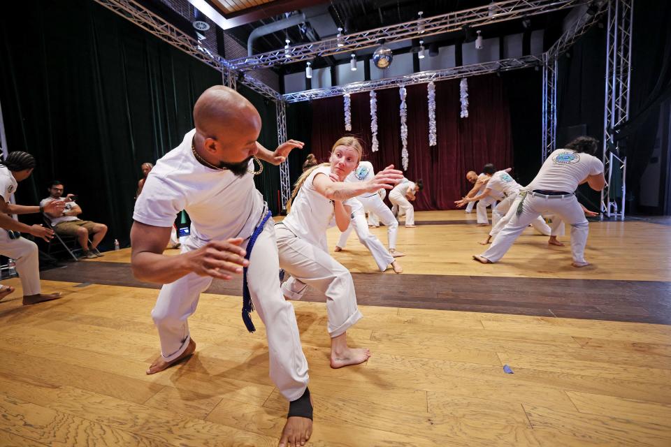 Luís Alberto Santana and Allyson Jelitto work out as they join other students in capoeira classes at Trolley Square in Salt Lake City on Friday, April 28, 2023. | Scott G Winterton, Deseret News
