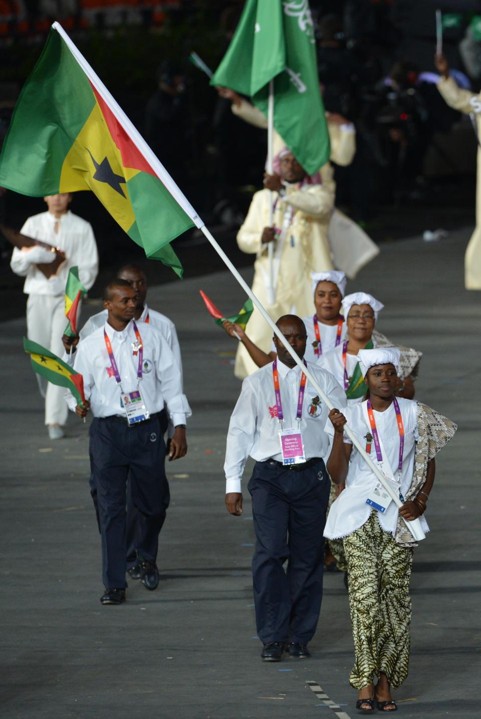 Sao Tome and Principe's flagbearer Lecabela Quaresma (C) leads her delegation during the opening ceremony of the London 2012 Olympic Games on July 27, 2012 at the Olympic Stadium in London. AFP PHOTO / GABRIEL BOUYSGABRIEL BOUYS/AFP/GettyImages