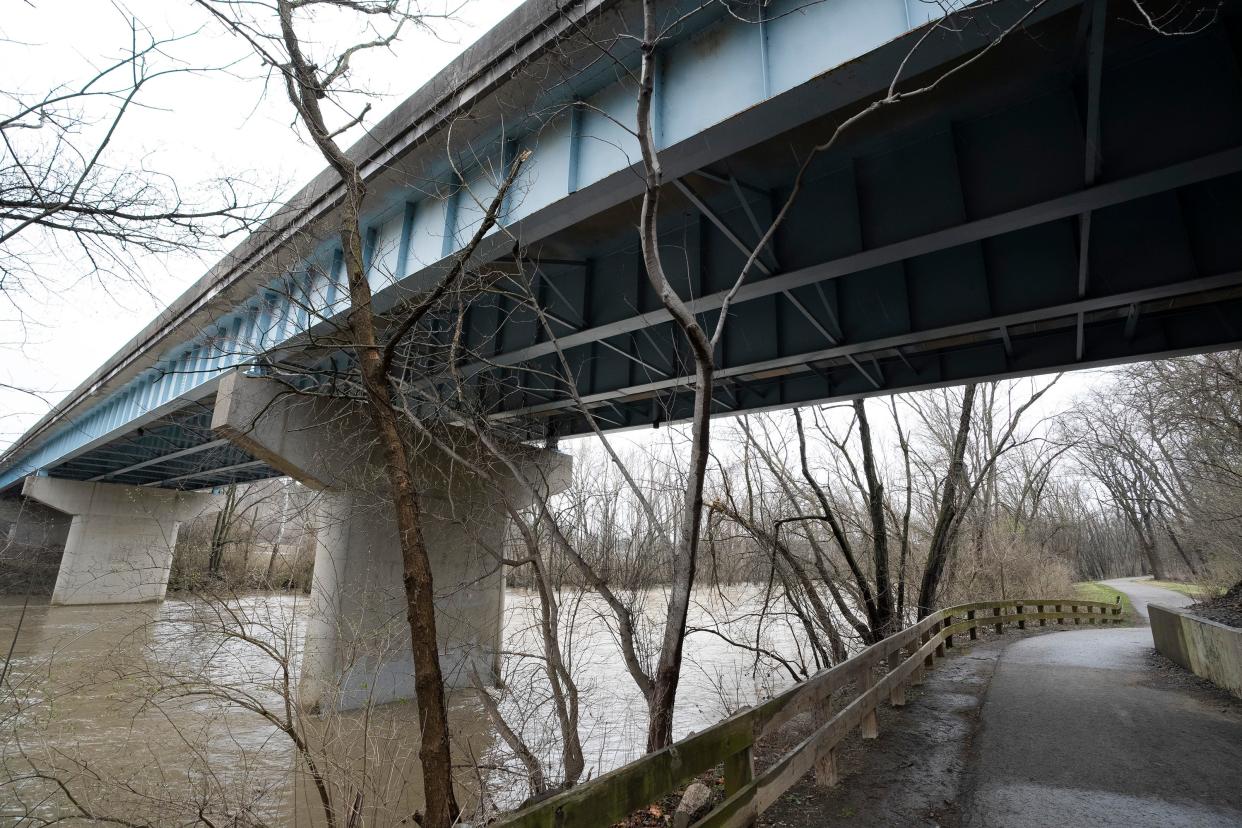 Mar 31, 2023; Worthington, Ohio, United States;  The bike path runs under the Wilson Bridge Road bridge that will be closed for three months during improvements. Mandatory Credit: Brooke LaValley/Columbus Dispatch