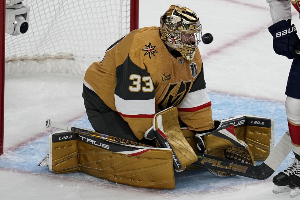 Vegas Golden Knights goaltender Adin Hill (33) stops a shot on goal against the Florida Panthers during the first period of Game 1 of the NHL hockey Stanley Cup Finals, Saturday, June 3, 2023, in Las Vegas. (AP Photo/Abbie Parr)