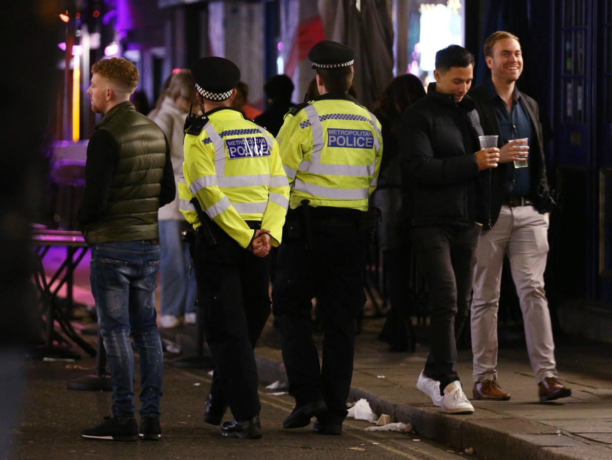 Police officers on patrol ahead of closing time in Soho, London, after pubs and restaurants were subject to a 10pm curfew to combat the rise in coronavirus cases in England. (Yui Mok/PA Wire)