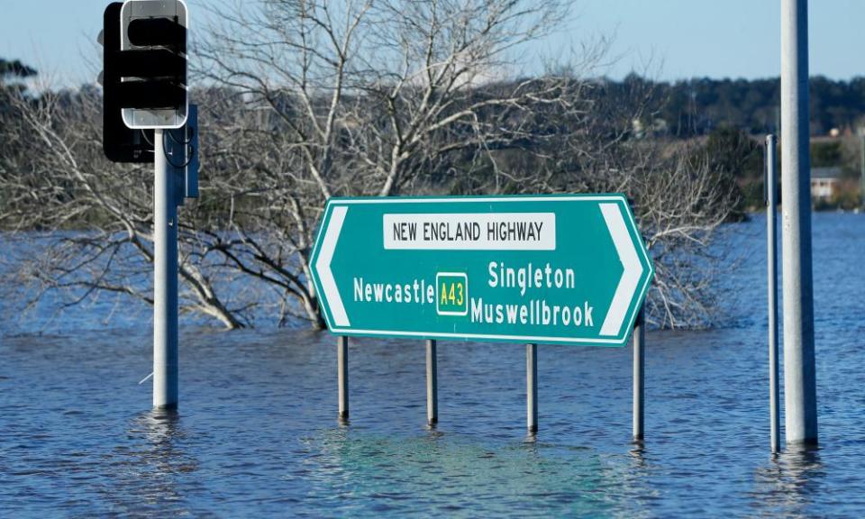 The New England Highway blocked by flood waters in Maitland, NSW