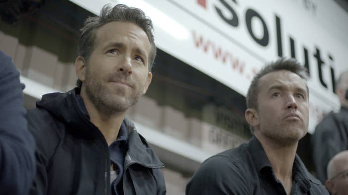 Ryan Reynolds and Rob McElhenney watching a game