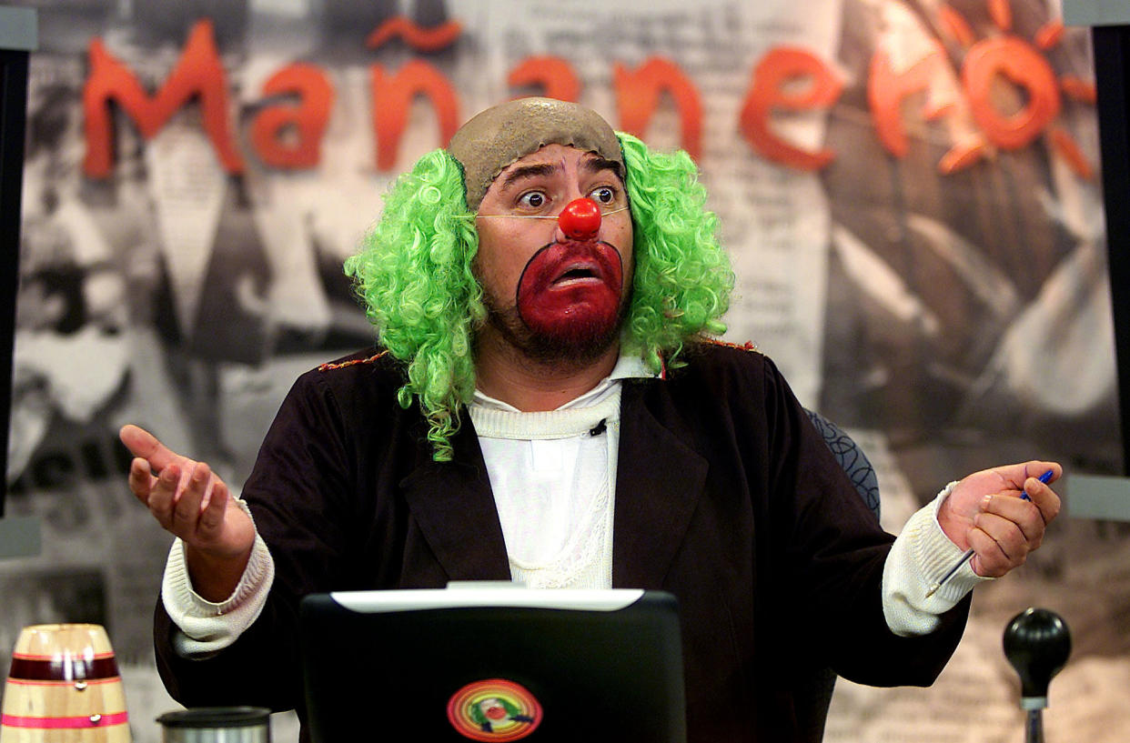 News commentator Victor Trujillo, in character as Brozo the clown,  exclaims as he gives the morning news in this photo taken January 24,  2002. Brozo has become one of Mexico's most popular and influential  newscasters with his three-hour morning show which includes merciless  political commentary, and plenty of bathroom and sex jokes. In January  Brozo moved to Televisa, Mexico's biggest broadcaster, where his news  show includes political guests, analysis of current scandals, a bogus  traffic reporter and a news summary delivered in rap, and where he is  getting high audience ratings. REUTERS/Daniel Aguilar TO GO WITH  MEXICO-CLOWN    DA/MMR