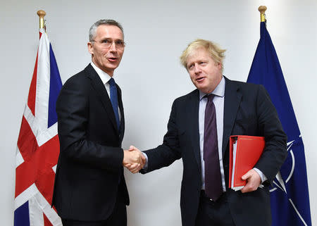 NATO Secretary-General Jens Stoltenberg poses with British Foreign Secretary Boris Johnson at the Alliance headquarters in Brussels, Belgium, March 19, 2018. Emmanuel Dunand/Pool via Reuters