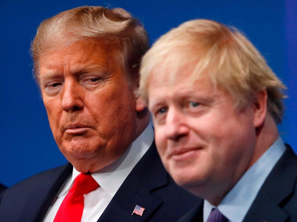 Britain's Prime Minister Boris Johnson (R) welcomes US President Donald Trump (L) to the NATO summit: AFP via Getty Images