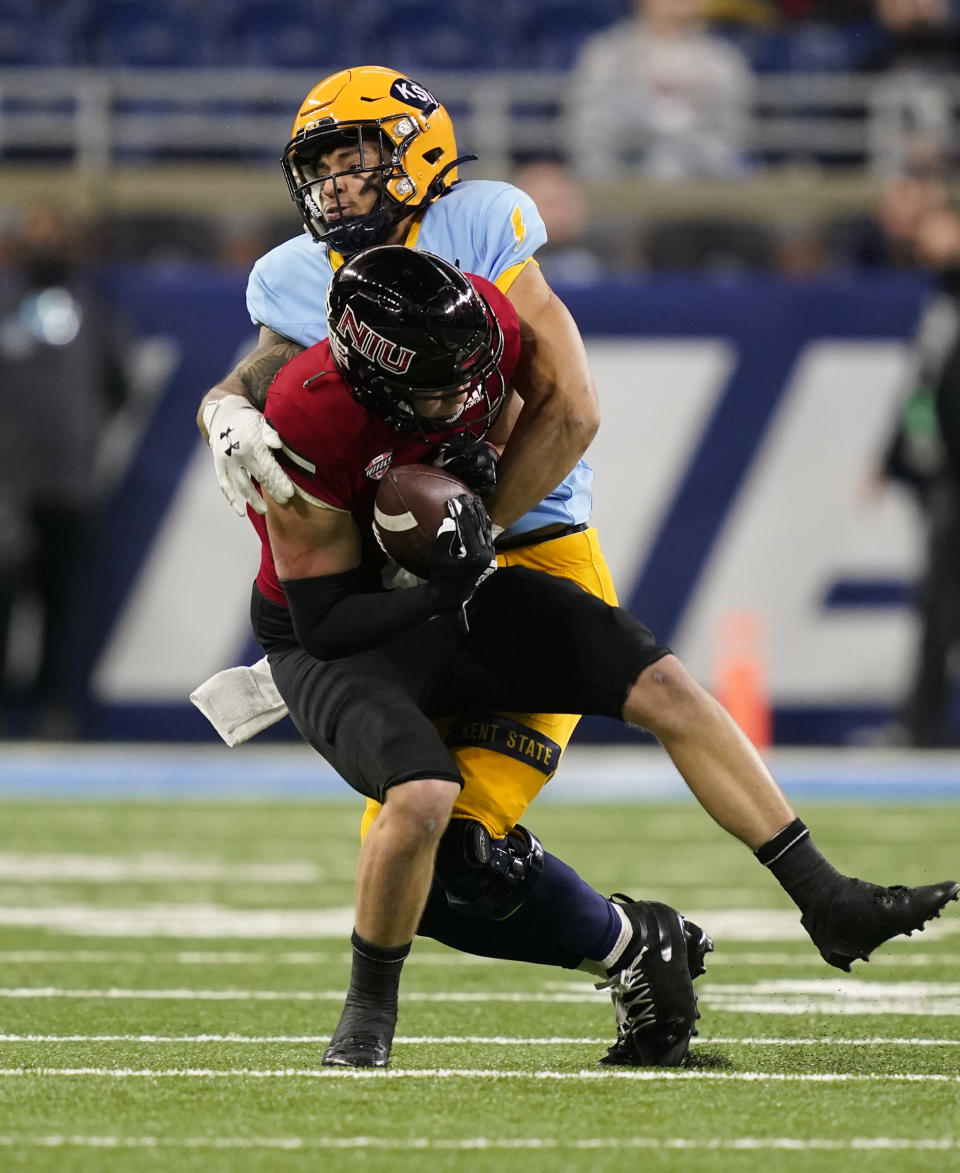 Northern Illinois Northern Illinois wide receiver Cole Tucker is tackled by Kent State safety Nico Bolden (24) after a catch during the first half of an NCAA college football game, Saturday, Dec. 4, 2021, in Detroit. (AP Photo/Carlos Osorio)