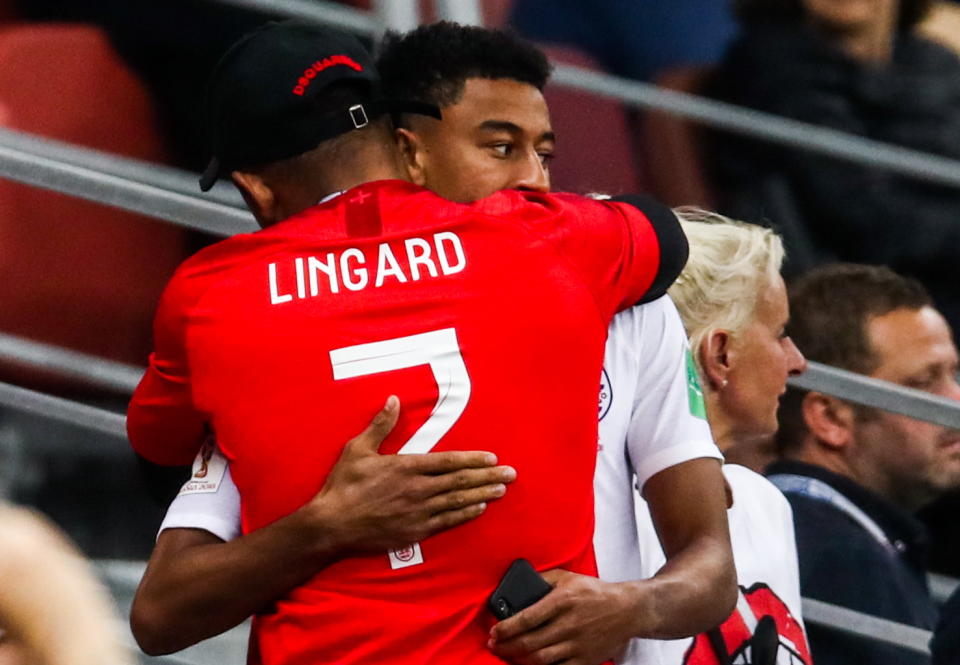 Not to be: Jesse Lingard gets a hug after the team fell to defeat